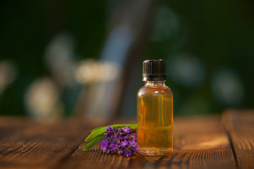lavender essential oil in  beautiful bottle on table
