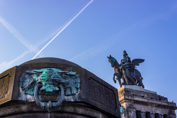 Lion or animal with ring in mouth in front of monument Kaiser Wilhelm I (Emperor William),...