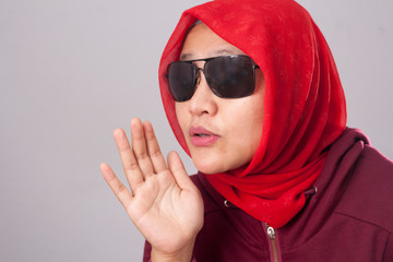 Muslim Lady in Red Whispering Something