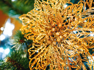 Elegant flower, made of fabric with sequins. New Year decoration for Christmas tree.