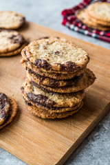 Classic Swedish Oatmeal Cookies with Chocolate on Wooden Board.
