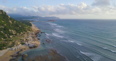 Aerial view beautiful tropical island beach sunrise, sunset from drone. Stock image of landscape paradise tropical island beach with sunrise, sunset ocean water, wave, sea surface. Amazing nature