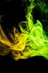 Fototapeta premium Colored smoke on black background