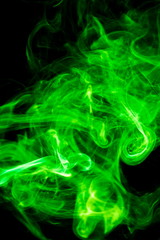 Green smoke on black background