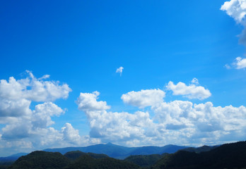 Mountain and cloud on blue background.