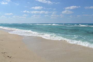 Fototapeta na wymiar Sand beach with blue sky