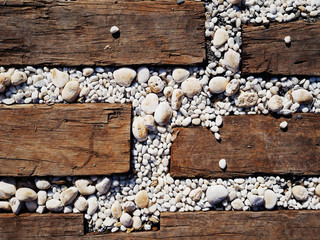 Brown wood and white stone on the floor.