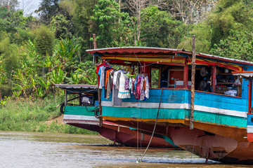 Wooden boat used as a house Laos