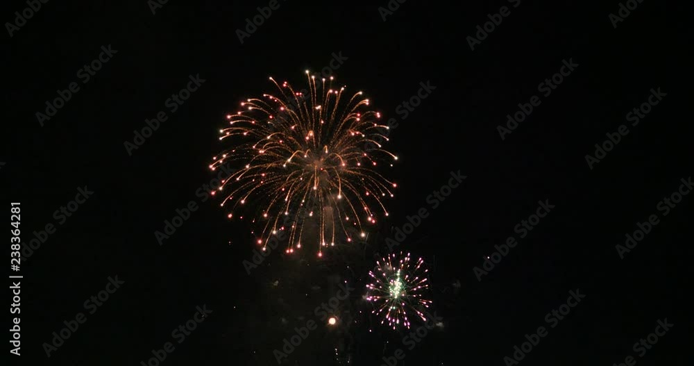 Aufkleber celebration firework exploding and glow over dark background with dark and grain processed