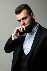 Business man with smartphone. Businessman with phone. Internet wireless technology. Professional communication in office. Modern businessman in work. Smartphone and phone concept. Adult succes.