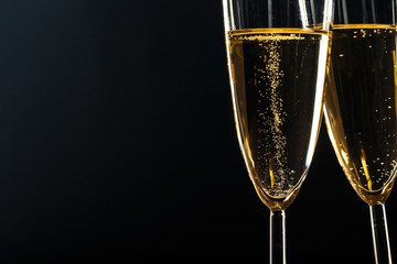 Champagne glasses for festive occasion against a dark background