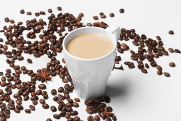 Coffee cup and beans on a white background