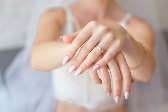 Close-up Woman showing her hands with beautiful manicure.Bride's hands with a nice manicure