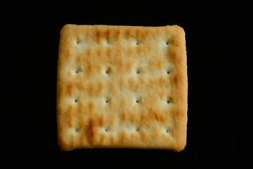 cracker on a black background