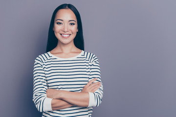 Close up portrait of attractive amazing brown-haired she her girl holding hands crossed with beaming kind toothy smile wearing white pullover isolated on grey background