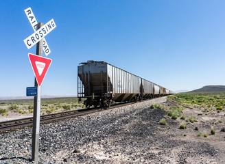 Alamogordo, NM / United States - July 10, 2016: Union Pacific freight train crosses a railroad...