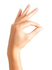 Woman hand showing mudra gesture or holding something.