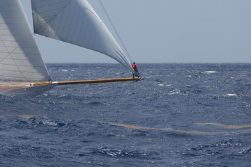2892 Sailor standing on bowsprit during Antigua Classics regatta, April 19, 2015