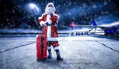 Red old Santa Claus and airport 