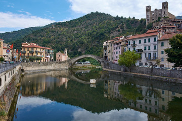 Fototapeta na wymiar Italy. Dolceacqua. Nervia River and Humpback Bridge in the old town. Monet Bridge