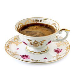 Turkish coffee in antique porcelain cup on white background 