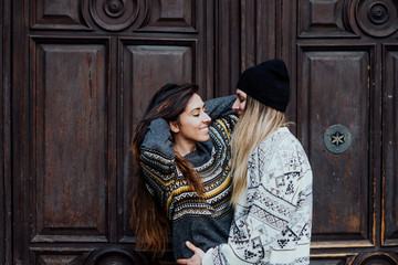 Couple women enjoying on the street in Madrid city