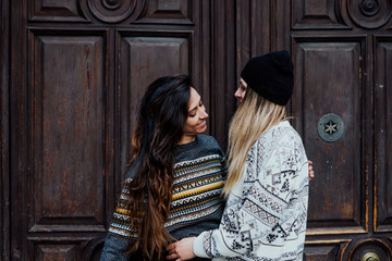 Couple women enjoying on the street in Madrid city