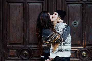 Couple women kissing on the street in Madrid city