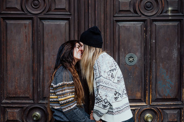 Couple women kissing on the street in Madrid city