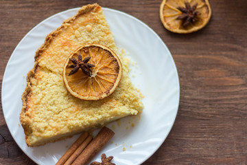 homemade cake with cottage cheese on a wooden background with elements of decor in a rustic style