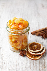 Pieces of candied orange peel coated in sugar in jar