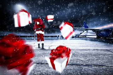 Red old Santa Claus on airport and dark magic night with moon 