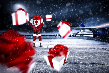 Red old Santa Claus on airport and dark magic night with moon 