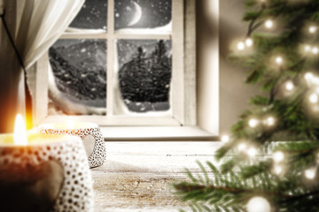 Table background with christmas tree and candle on top . Free space for your decoration 