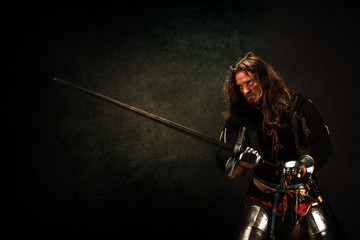 Portrait of a knight armed with a claymore