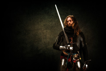 Portrait of a knight armed with a claymore