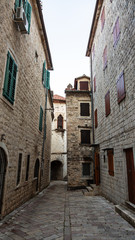 Fototapeta na wymiar Beautiful narrow streets of the old European city. stone paved paths.