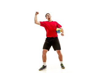 The happy fit caucasian young male handball player at studio on white background. Win, winner, human emotions concept