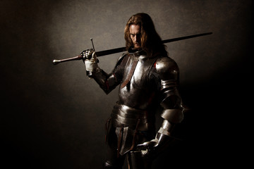 Portrait of a knight in armor  - obrazy, fototapety, plakaty