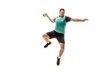 Fototapeta na wymiar The fit caucasian young male handball player at studio on white background. Fit athlete isolated on white. The man in action, motion, movement. attack and defense concept