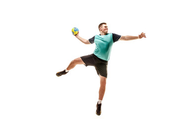 The fit caucasian young male handball player at studio on white background. Fit athlete isolated on...
