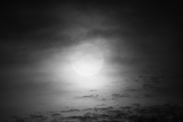 Full Moon and clouds on the night sky