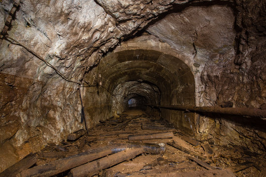 Underground abandoned gold iron ore mine shaft tunnel gallery passage 