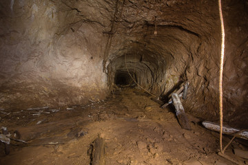 Underground abandoned gold iron ore mine shaft tunnel gallery passage 