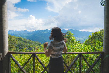 Fototapeta na wymiar Happy young cute asian girl hipster backpack women travelling looking at beautiful sky mountains scenery views 