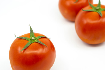 Ripe tomato isolated on white background.