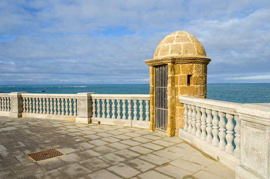 Remnants of the city walls with the bartizan, integrated in a modern balustrade of Alameda Apodaca  in the Old Town of Cadiz, Spain