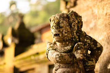 Stone carved demons protecting the staircase entrance of Pura Kehen hindu temple in Bali, Indonesia.