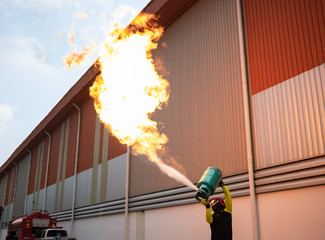 Fireman Training Officer Using a gas tank to teach and show the release of gas.