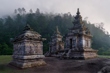 Candi Gedong Songo at sunrise. A 9th-century Buddhist temple complex on a volcano near Semarang, Java, Indonesia.